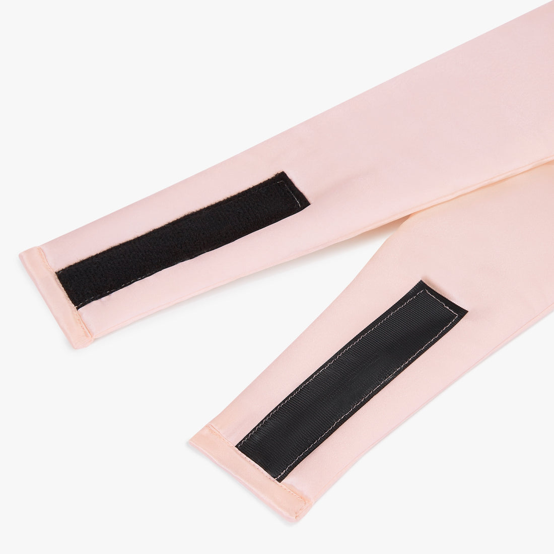 Two pink straps with black Velcro fasteners on a white background Nº 12 Éclat de Rose