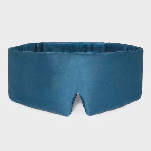 Blue sleep mask on a light gray background Nº 14 Bleu Céleste 