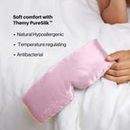 Pink satin pillowcase held by a person with text about Themy PureSilk on a white background Nº 12 Éclat de Rose