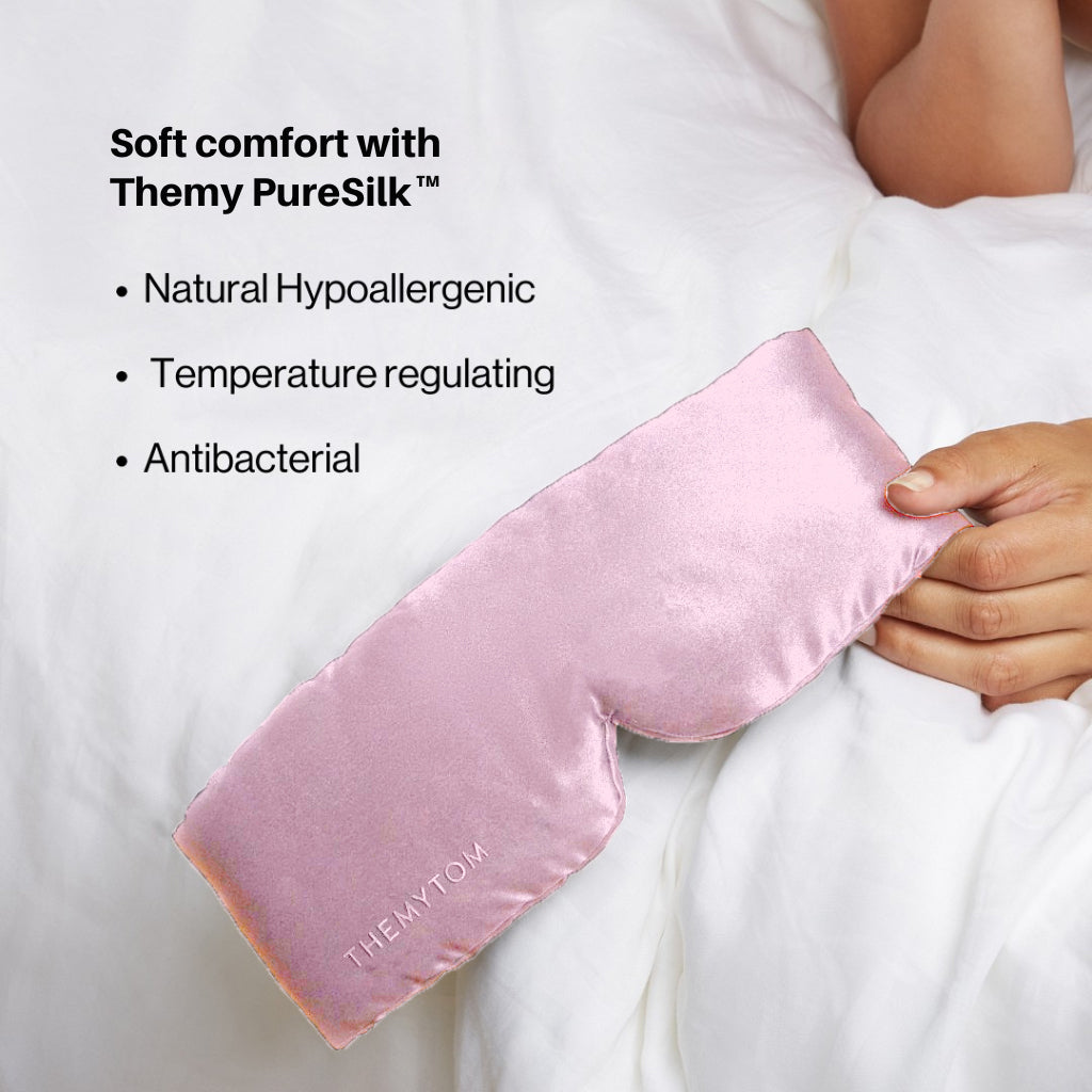 Pink satin pillowcase held by a person with text about Themy PureSilk on a white background Nº 12 Éclat de Rose