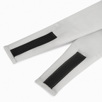 Two white straps with black Velcro fasteners on a white background Nº 08 Brume d’Argent
